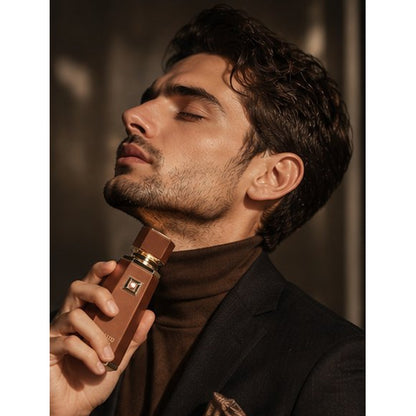 Man holding perfume bottle
